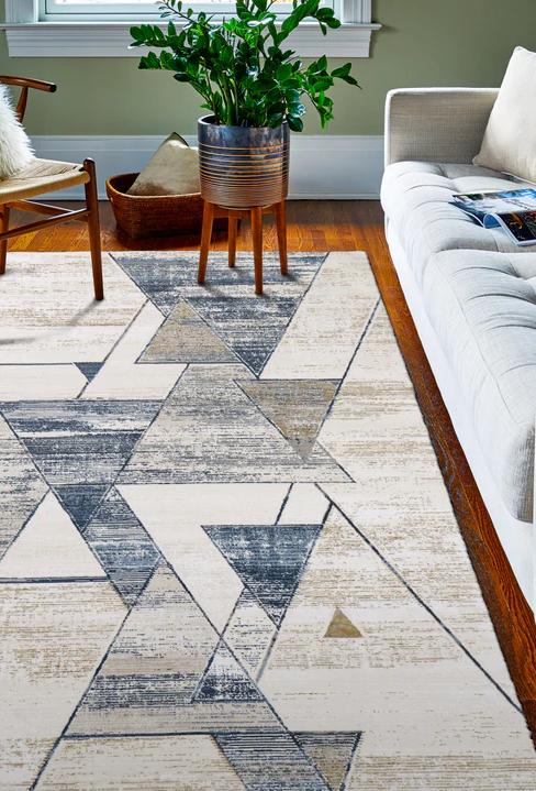 Four 100% Indian Wool Hand-Tufted Contemporary style area rugs stacked diagonally.